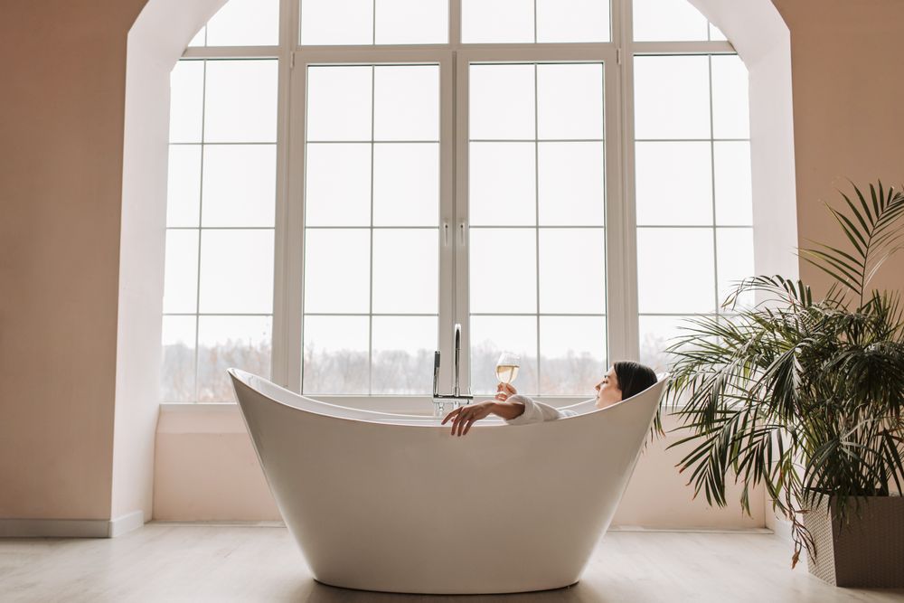 Private treatment room with a single draped massage bed