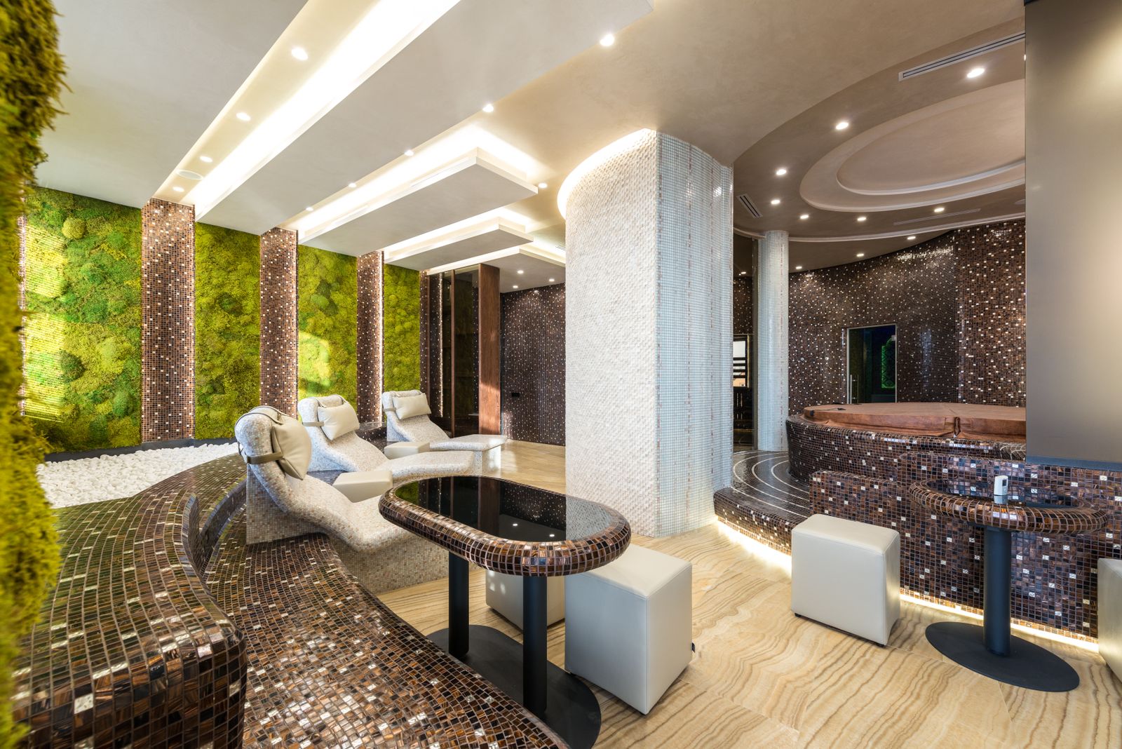 Reception and waiting area with low seating and warm lighting