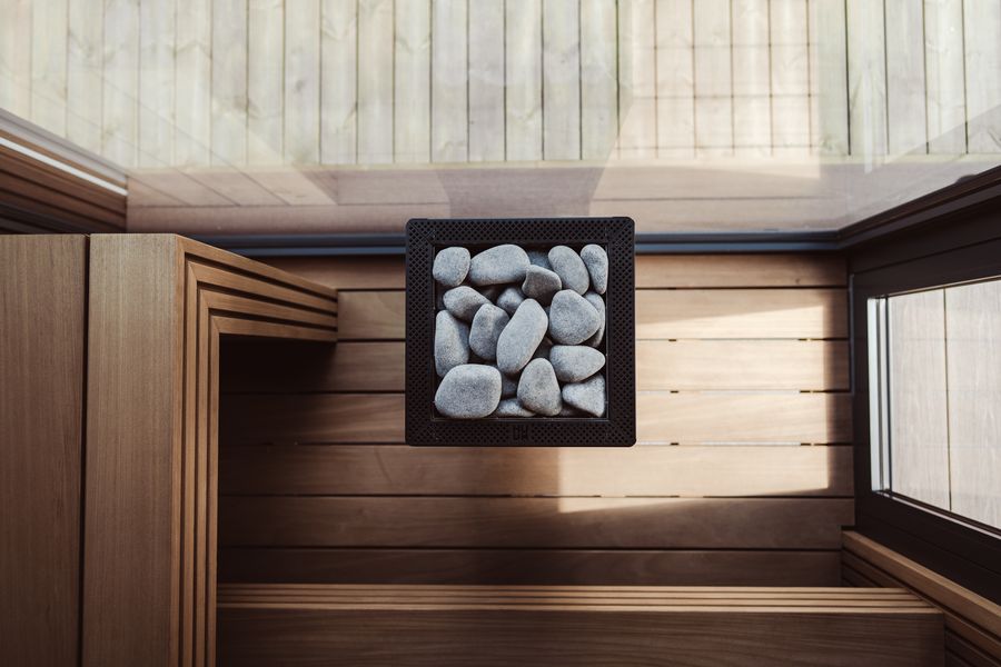 Wood-lined Russian banya steam room prepared for a session